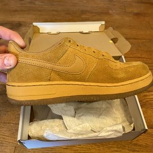 Like new. Nike’s size 1Yr. Gold.